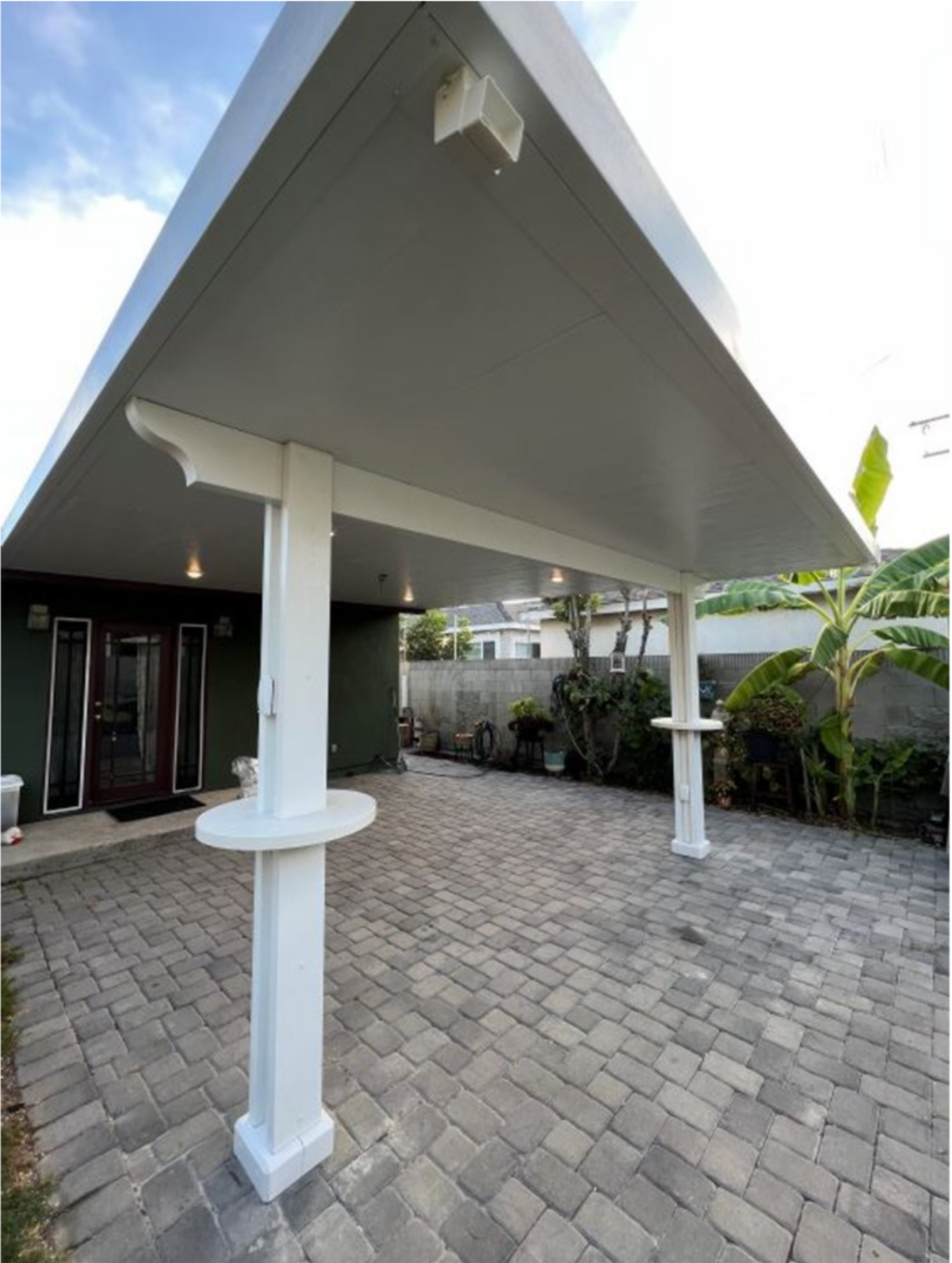 Attached patio cover with two posts and alumatables installed