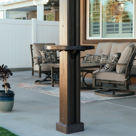 Live product photo of a brown Alumatable installed on a patio cover post of the same color