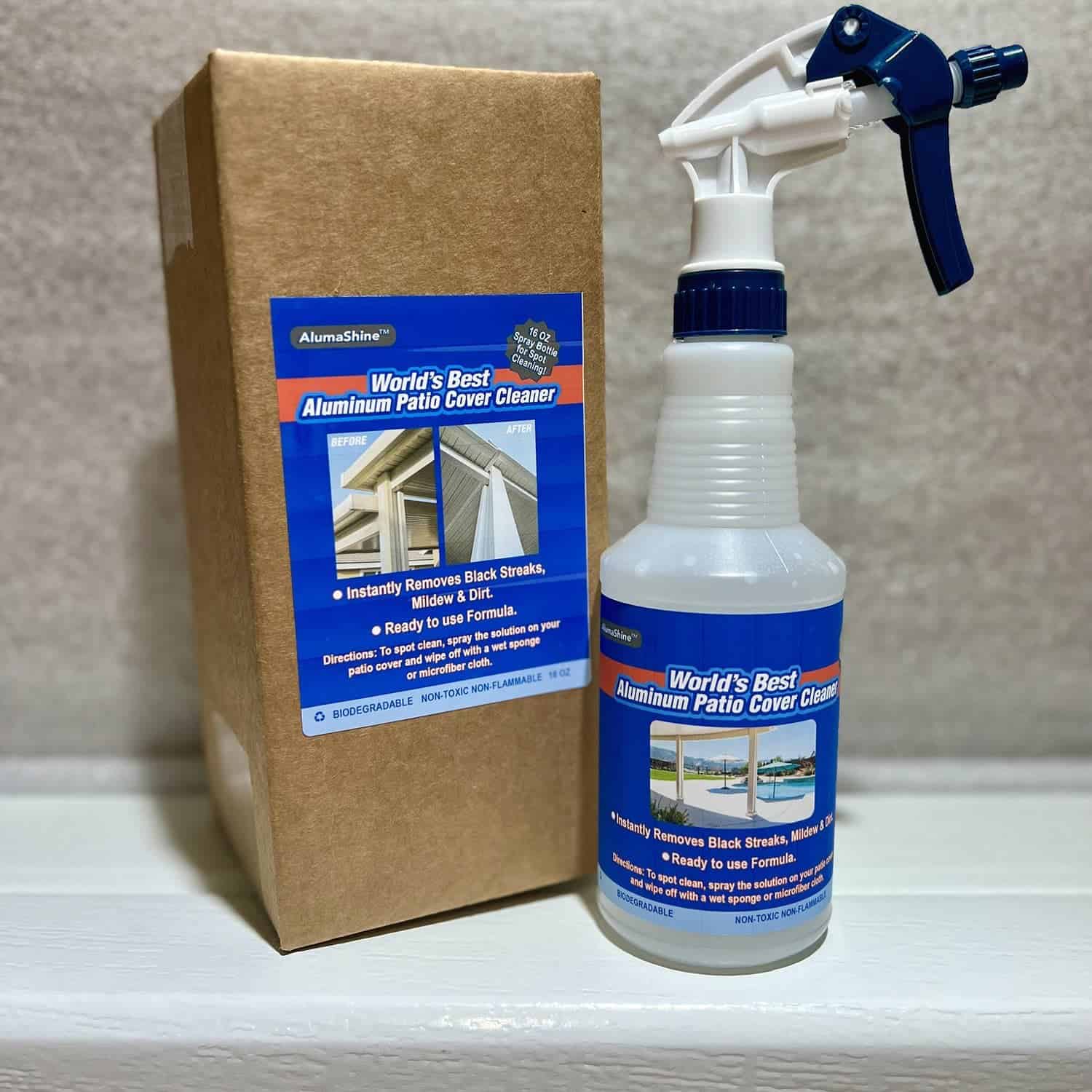 Spray bottle of Alumashine patio cover cleaner next to a box that contains the same product