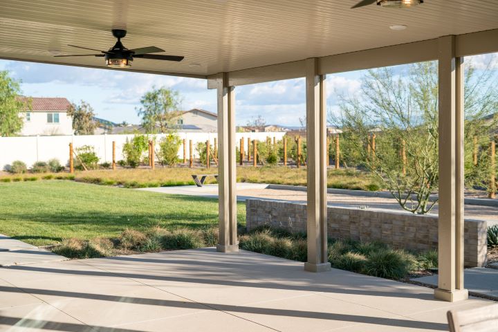 Alumawood patio cover with alumabase on each post base, overhead lighting, and ceiling fans
