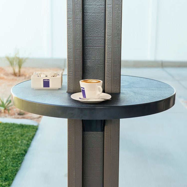 Coffee mug resting on top of an alumatable