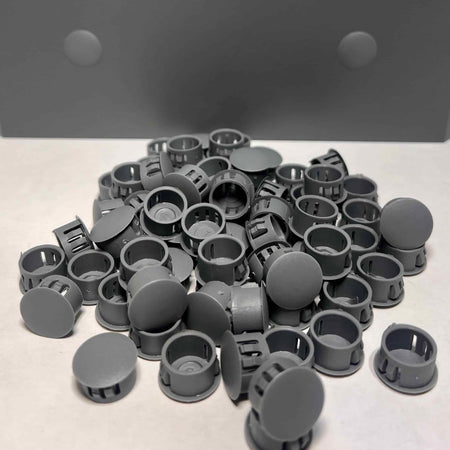 Graphite color patio cover hole plugs in a pile