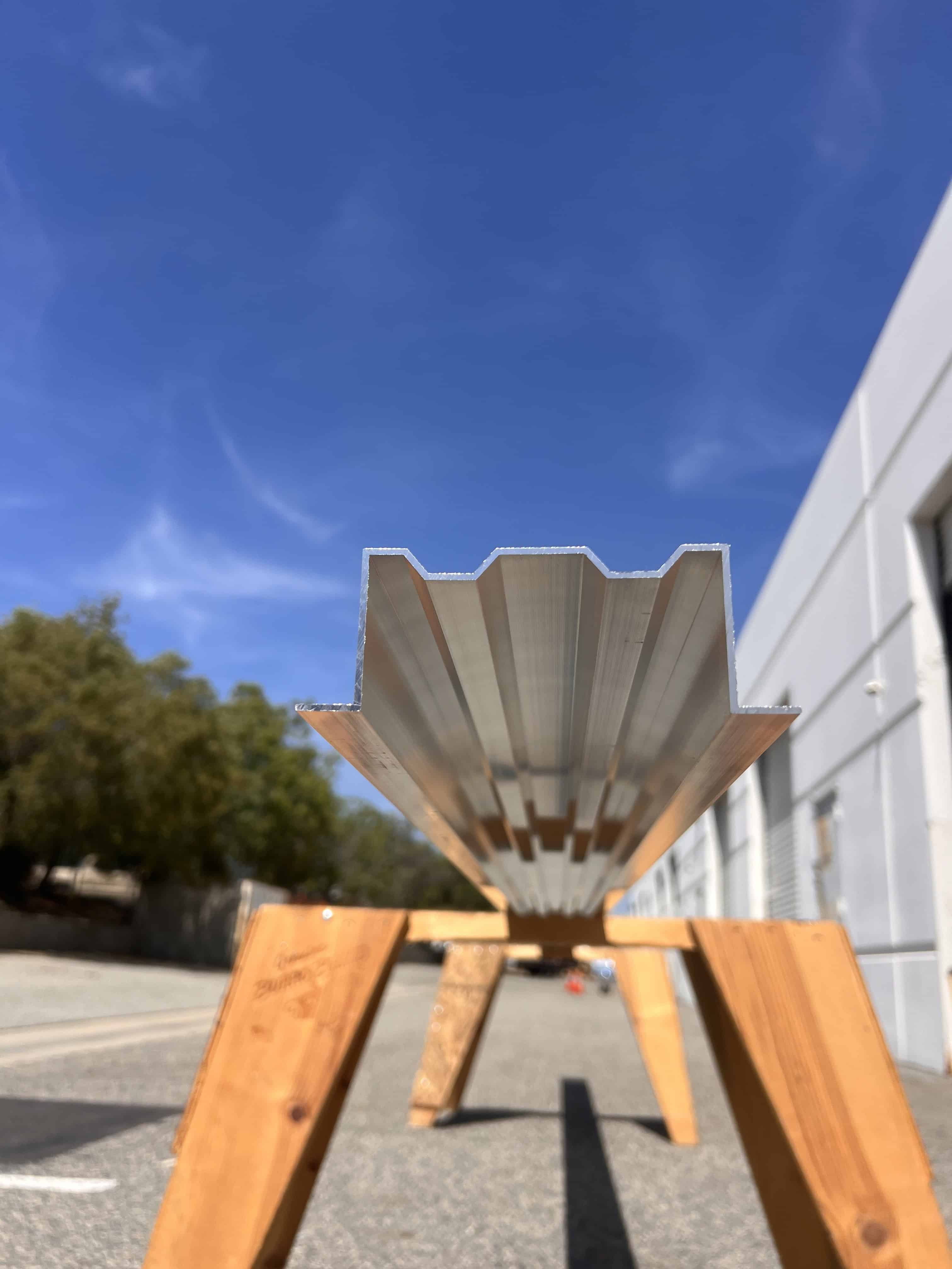 Low angle photo of the megabeam resting on a wooden stand