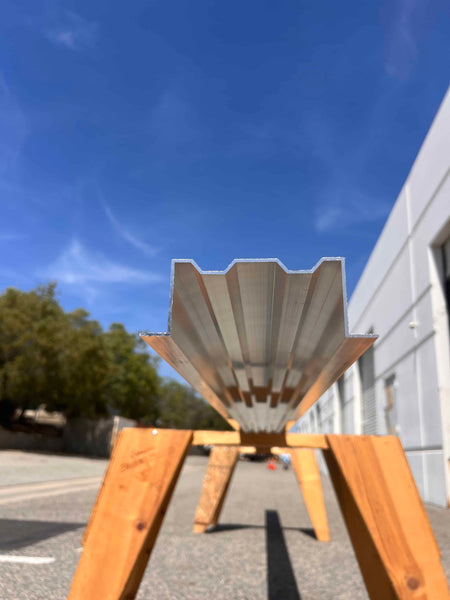 Low angle photo of the megabeam resting on a wooden stand