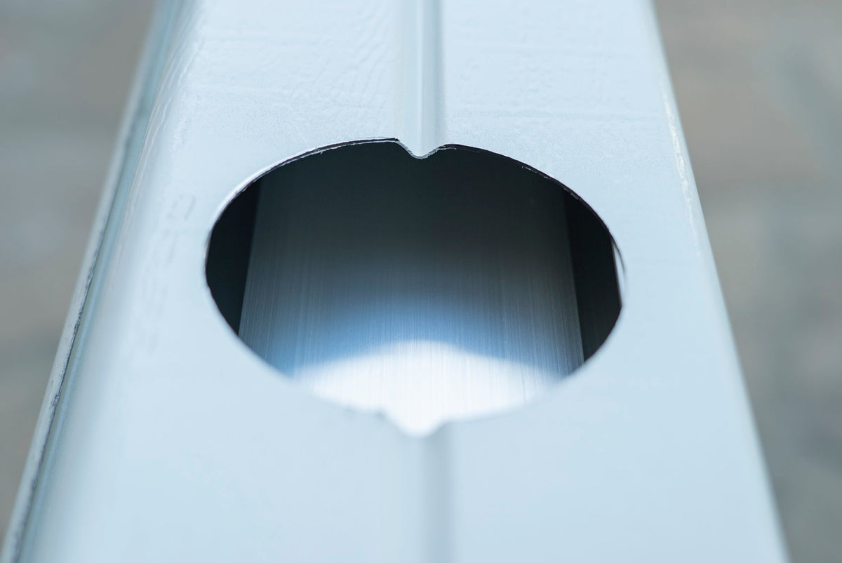 Hole in a patio cover post drilled using a 4-inch hole saw