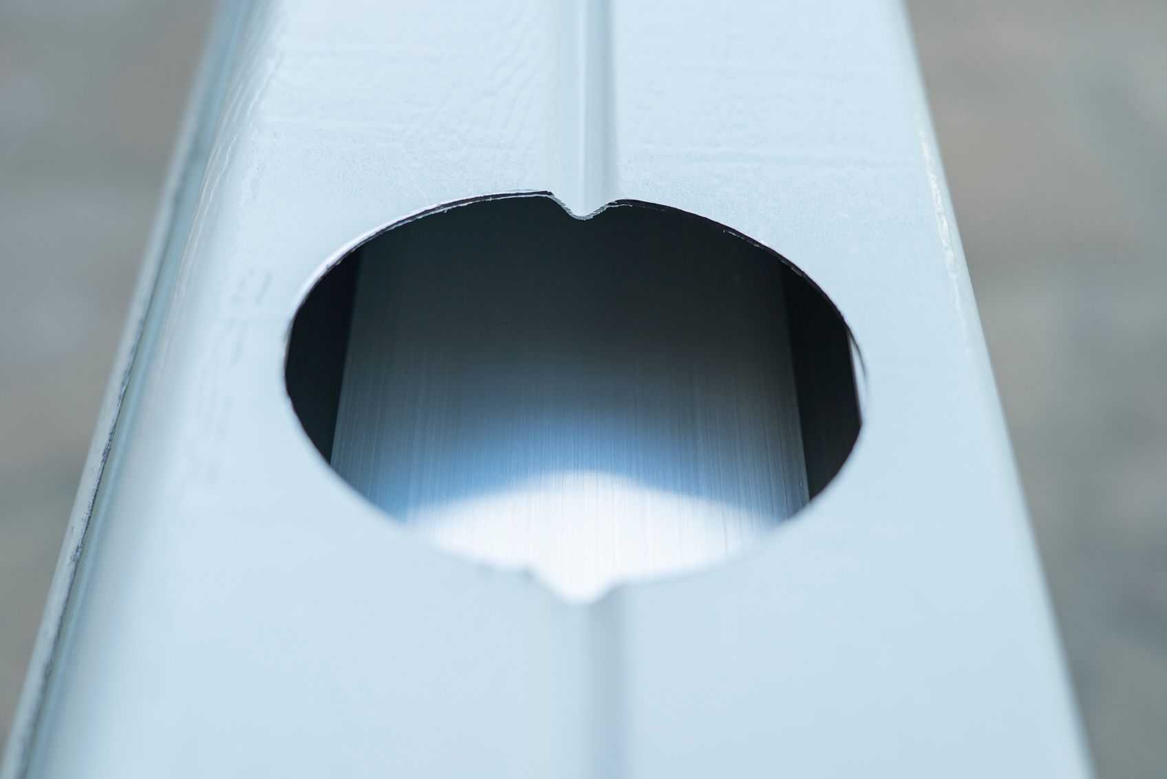 Hole in a patio cover post drilled using a 4-inch hole saw