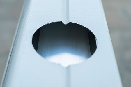 Hole in a patio cover post drilled using a 4-inch hole saw