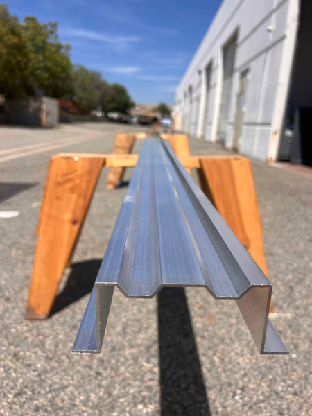 Alternate angle of the Mega beam resting on a wooden stand
